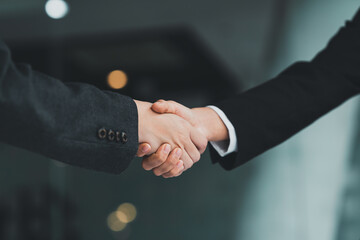 Business partnership meeting concept. Image businessmans handshake. Successful businessmen handshaking after good deal. Group support concept.