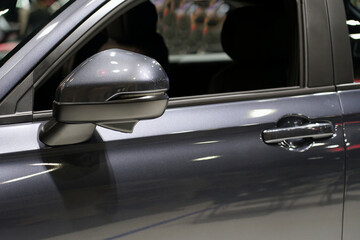Side view mirror in modern suv car.