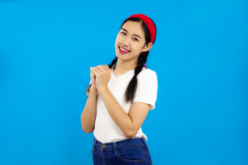 Portrait of Young Asian girls over isolated blue background, people emotions concept