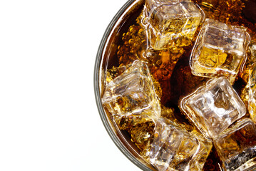 Cola glass with crushed on a white background cola ice in glass and there is water droplets around. cool black fresh drink.