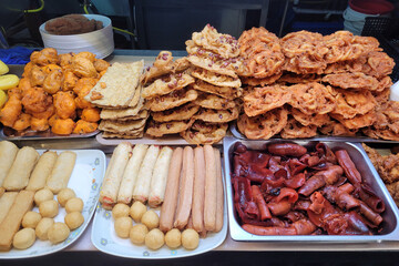 Various choices of ingredients for Pasembur. Pasembur is a Malaysian salad consisting of beancurd bean sprouts, prawn fritters, fried squid or other seafoods served with a sweet and spicy nut sauce.