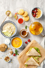 Overhead view of breakfast on light grey background