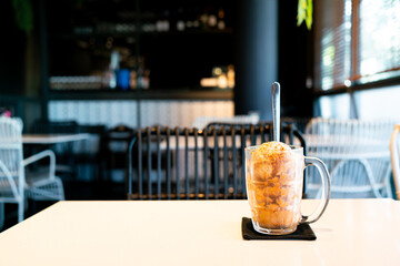 Thai tea ice scoop in glass