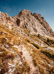 Mountain climber on a steep and exposed Via Ferrata Col dei Bos near passo falzarego. Majestic...
