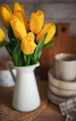 Beautiful tulip flowers  on table at kitchen