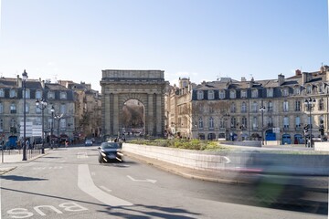 The porte de Porte de Bourgogne in Bordeaux France during the daytime with the city traffic