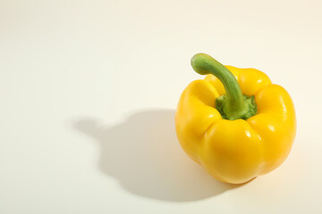 Yellow bell pepper on white background, space for text