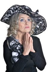  gorgeous mature woman in hat praying