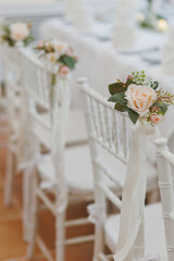 Floral decoration on a chair at the wedding reception