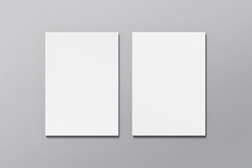 A4 magazine mockup top view, book or catalog on gray table. Blank page or notepad on solid background. Blank page or notepad for mockups or simulations.