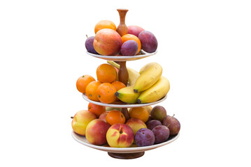 Fruit holder isolated on white background with various types of fruit, bananas, oranges, peaches, plums. Side view