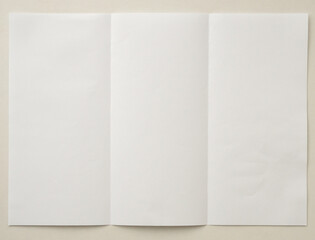 White folded and wrinkled paper on white background