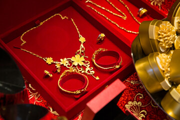 Gold jewelry in a red gift box for a Chinese wedding