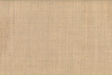 Fototapeta na wymiar The texture of coarse linen natural fabric of natural color. Abstract rough background. Natural flax.