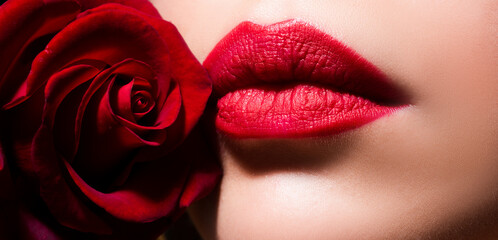 Beauty Red Lips Makeup Detail. Beautiful woman lips with rose.