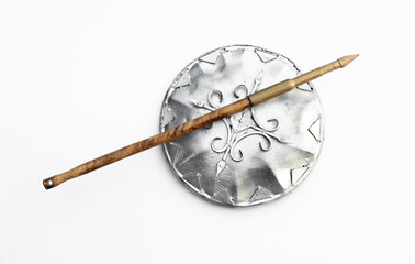 silver shield and spear isolated on white background