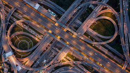 Aerial top view road traffic interchange in city, Aerial view of highway and overpass in city, Expressway top view, Road traffic an important infrastructure, Ecology. - obrazy, fototapety, plakaty