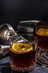Hard alcohol drink with orange slice garnish. Negroni cocktail with dried orange and whiskey, copy space