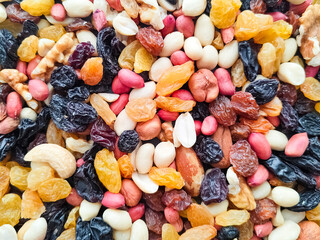 Nuts and raisin mixture - colorful background. Top view. 