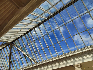 Skylight or glass sunroof ceiling of a building. Window in commercial office or industrial building. Modern design architecture, or energy conservation model using nature sunlight concept.