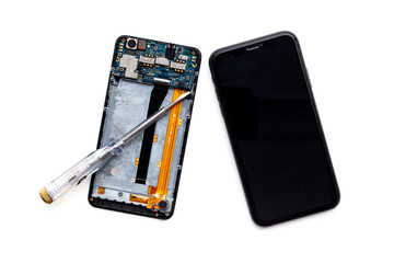 Electronics servise and repair concept - mobile phone with circuit board
