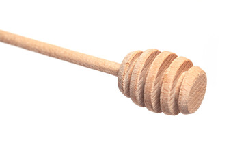 Wooden honey dipper isolated on a white background.