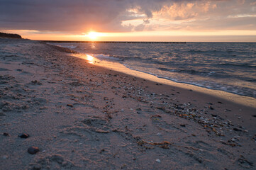 Fototapeta na wymiar Sunset on the Baltic Sea. Sea, bean strong colors. Vacation on the beach. Landscape