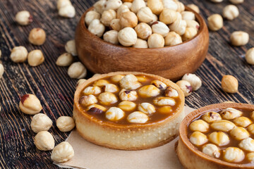 delicious tartlet cake with soft caramel and roasted hazelnut