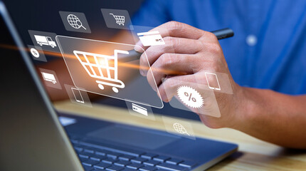 Shopper using computer laptop to input order with trolley credit card delivery truck for online shopping and e-commerce technology concept.