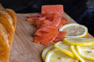 cutting fish fillets during the preparation of a dish of red salmon fish