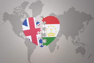 puzzle heart with the national flag of tajikistan and great britain on a world map background. Concept.