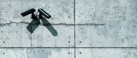 Surveillance Security Camera with Grunge concrete cement wall in the city