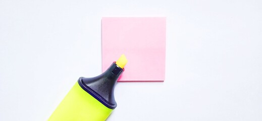 A marker and blank sticky notes isolated on gray white background.