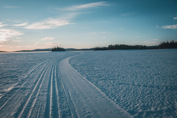 Cross country ski track leading towards the horizon on Lake Storsjö close to swedish Ljungdalen on...
