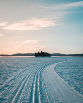 Cross country ski track leading towards the horizon on Lake Storsjö close to swedish Ljungdalen on the ice during winter. Copy space included.