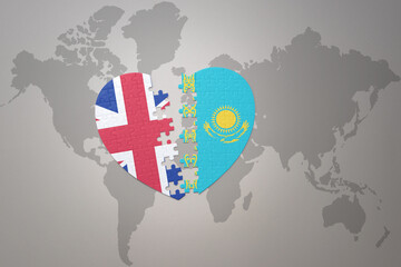 puzzle heart with the national flag of kazakhstan and great britain on a world map background. Concept.