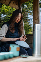 Girl playing the glucophone outdoors. High quality photo