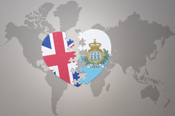 puzzle heart with the national flag of san marino and great britain on a world map background. Concept.