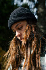 Portrait of an attractive girl in a black hat