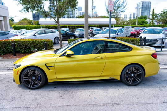 Miami Beach, Florida USA - April 15, 2021: Yellow Bmw M4, Side View. Luxury Sportcar