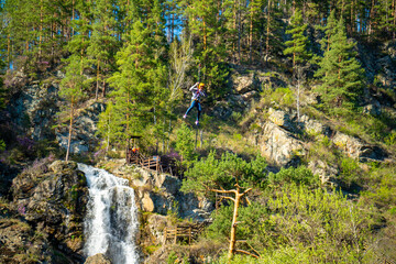Kamysh waterfall in the Altai Republic, viewing platforms and a platform for descent on a cable...