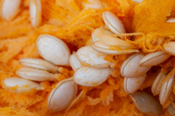 ripe orange pumpkin while cooking food in the kitchen