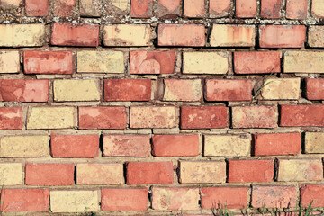 Brick wall of yellow and red bricks