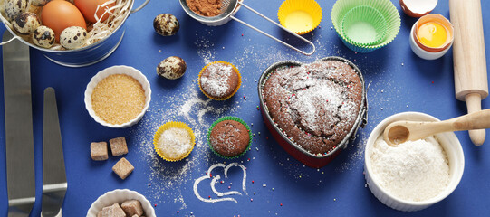 Freshly baked cake on blue background.