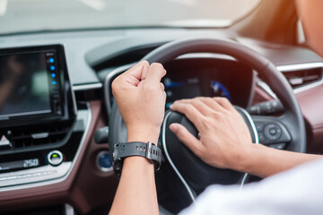 man driver honking a car during driving on traffic road, hand controlling steering wheel in vehicle. Journey, trip and safety Transportation concepts