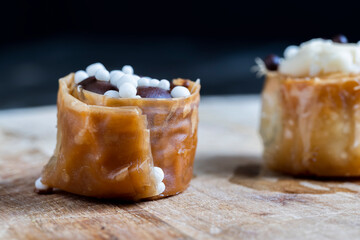 decorated dessert of sweet puff pastry with chocolate filling and natural honey