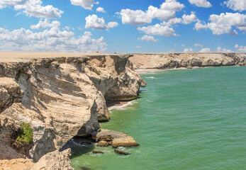 Fototapeta na wymiar Muscat, Oman - along the highway between Muscat and Sur, Oman displays dozens of wonderful beaches, both sandy and rocky, with dunes or cliffs, and amazing green waters 