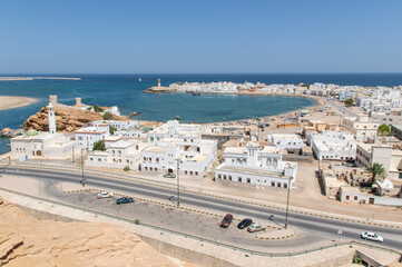 Sur, Oman - an important point for sailors and famous also for its building wooden ships, Sur is a pearl of Oman, with its fusion of green waters, white buildings and red rocks
