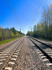 Fototapeta na wymiar Empty railways, blue sky, iron rails