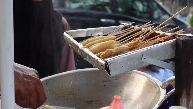 Cilor is a typical Indonesian street food made from starch, fried on a bamboo skewer and seasoned with spices